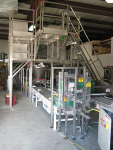 denesting section of minor ingredient batching system